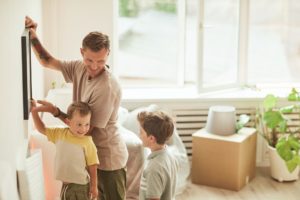 Father and Sons Hanging Pictures